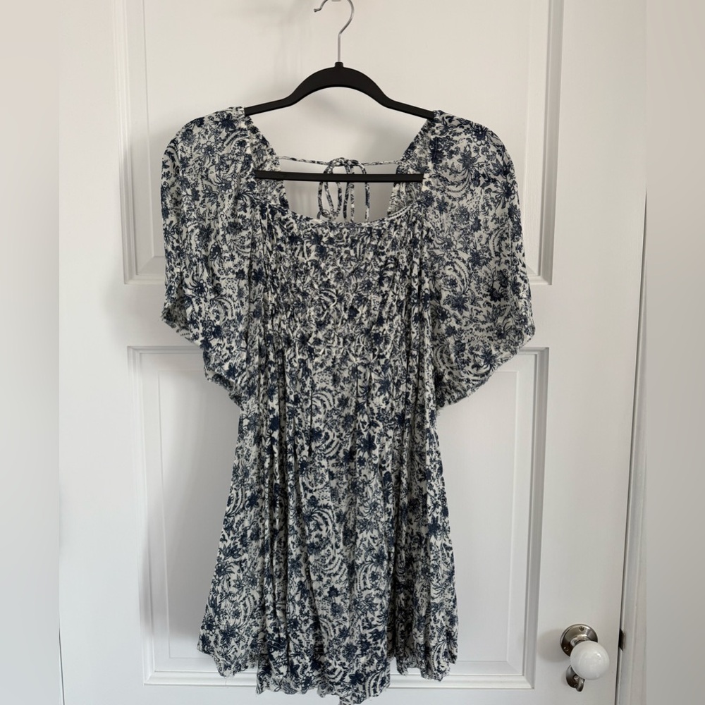 Free People smocked floral print top. Never worn.  NWOT,